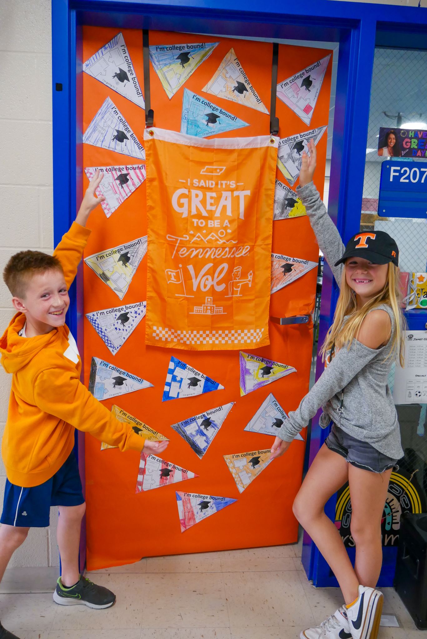 students in University of Tennessee gear showing off their decorated classroom door